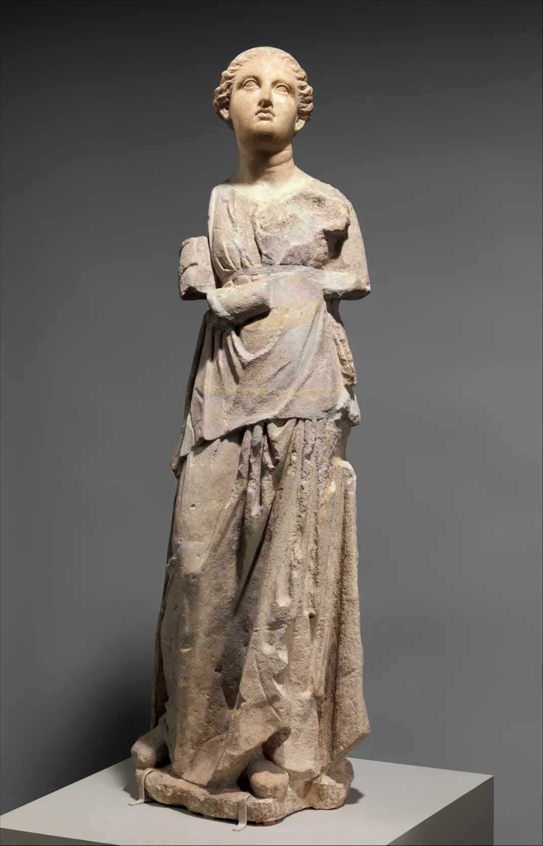 Marble and limestone statue of an attendant, Greek, Hellenistic, late fourth or third century B.C.E.