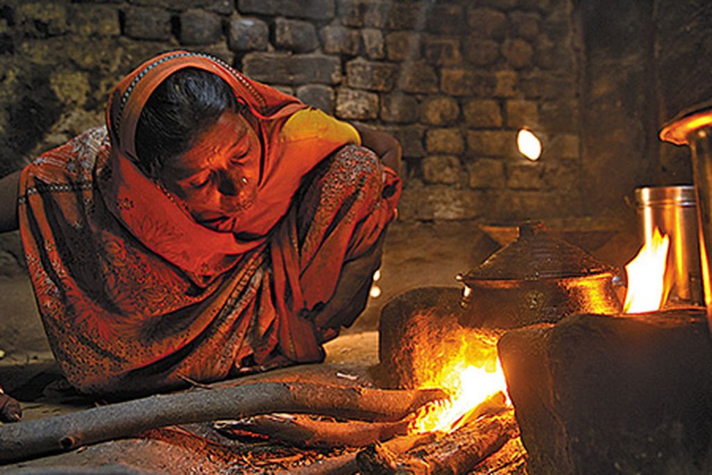 Woman and open fire stove