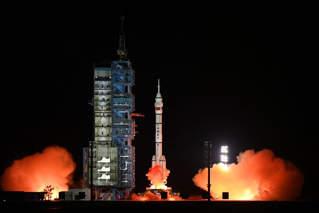 The rocket carrying the spacecraft with the three Chinese astronauts lifts off from Earth