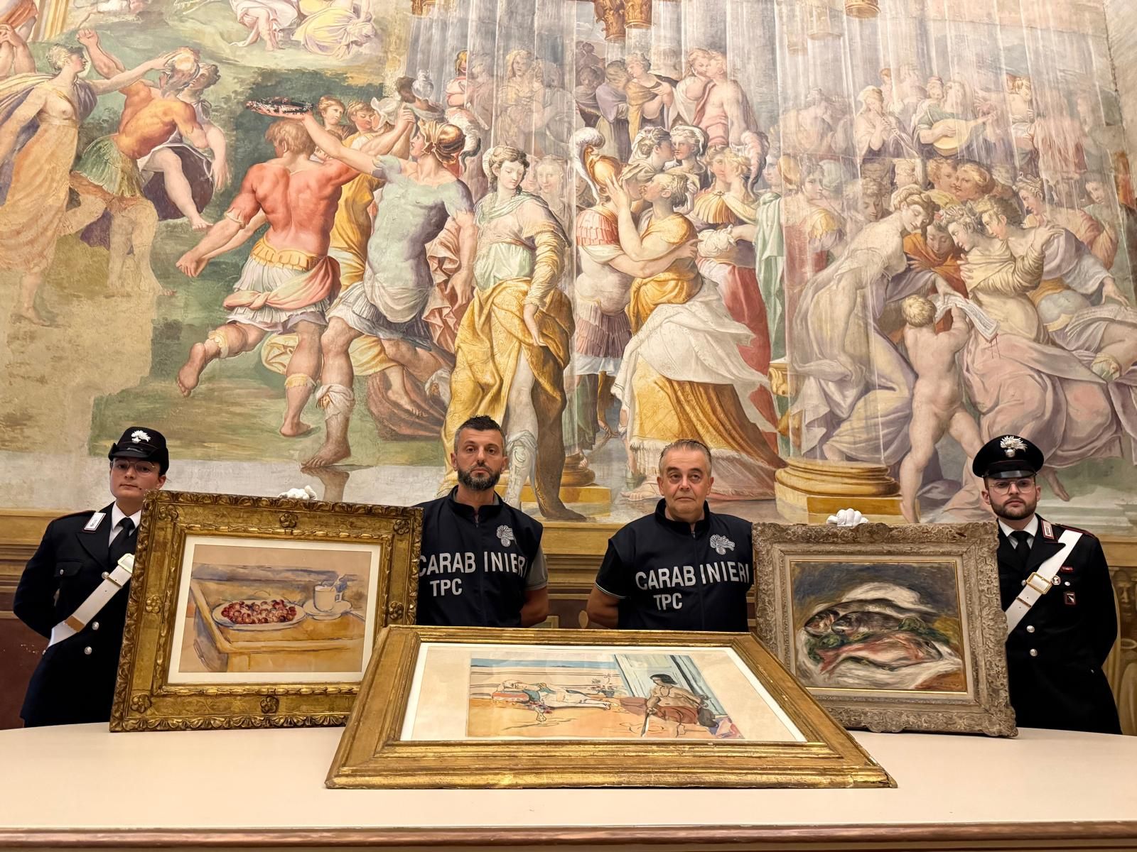 Italian officials pose with the three recovered artworks: Paul C&amp;eacute;zanne&amp;rsquo;s Still Life With Cherries,&amp;nbsp;Pierre-Auguste Renoir&amp;rsquo;s Les Poissons&amp;nbsp;and Henri Matisse&amp;rsquo;s Odalisque on the Terrace.