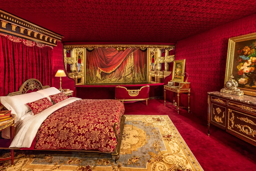 Lavish bedroom decorated with red and gold