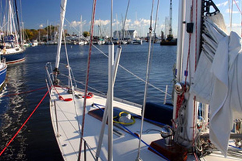 A sailboat floats at the dock