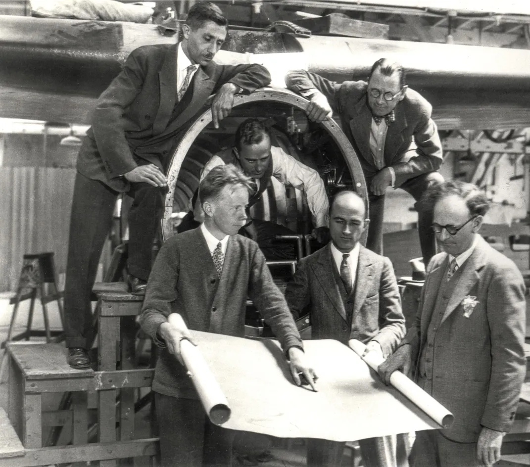 Jack Northrop and engineers pose around Model 1 Vega