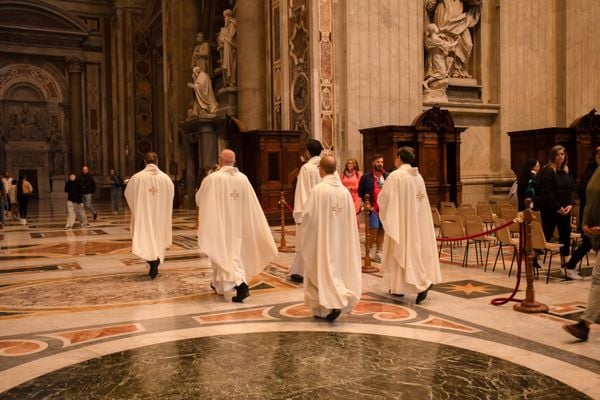 Priests inside St. Peters Basilica thumbnail