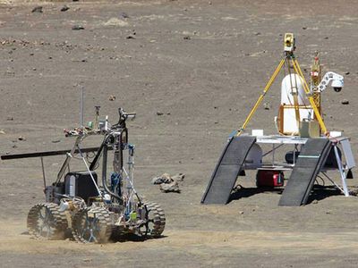 Earth prototype of the Resource Prospector rover (carrying the RESOLVE payload) and lander during recent field tests at Mauna Kea, Hawaii.