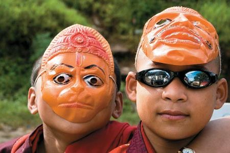 Tradition and change coalesce (young monks at a religious festival sport trendy shades, masks and a swastika&mdash;for Buddhists, a symbol of good fortune) in the remote, majestic country its citizens call Druk Yul or "Land of the Thunder Dragon."
