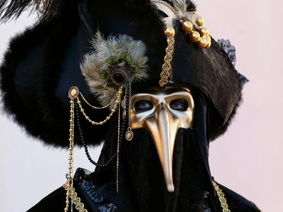 The Black Death is immortalized by the plague masks of Venice, like this stylized version used in a Carnival costume.