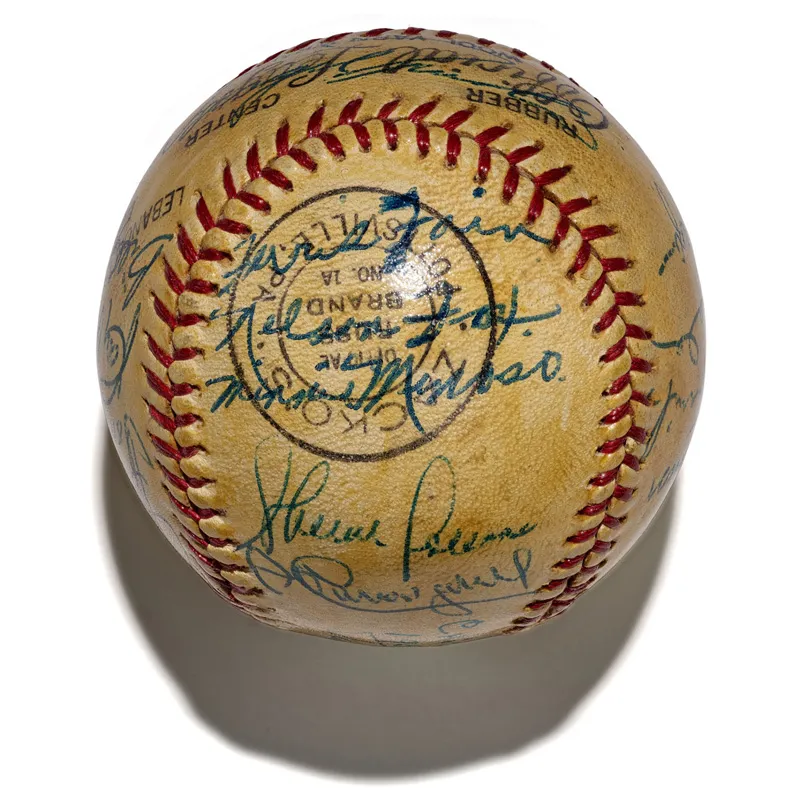 Yellowed baseball signed by members of the 1953 White Sox