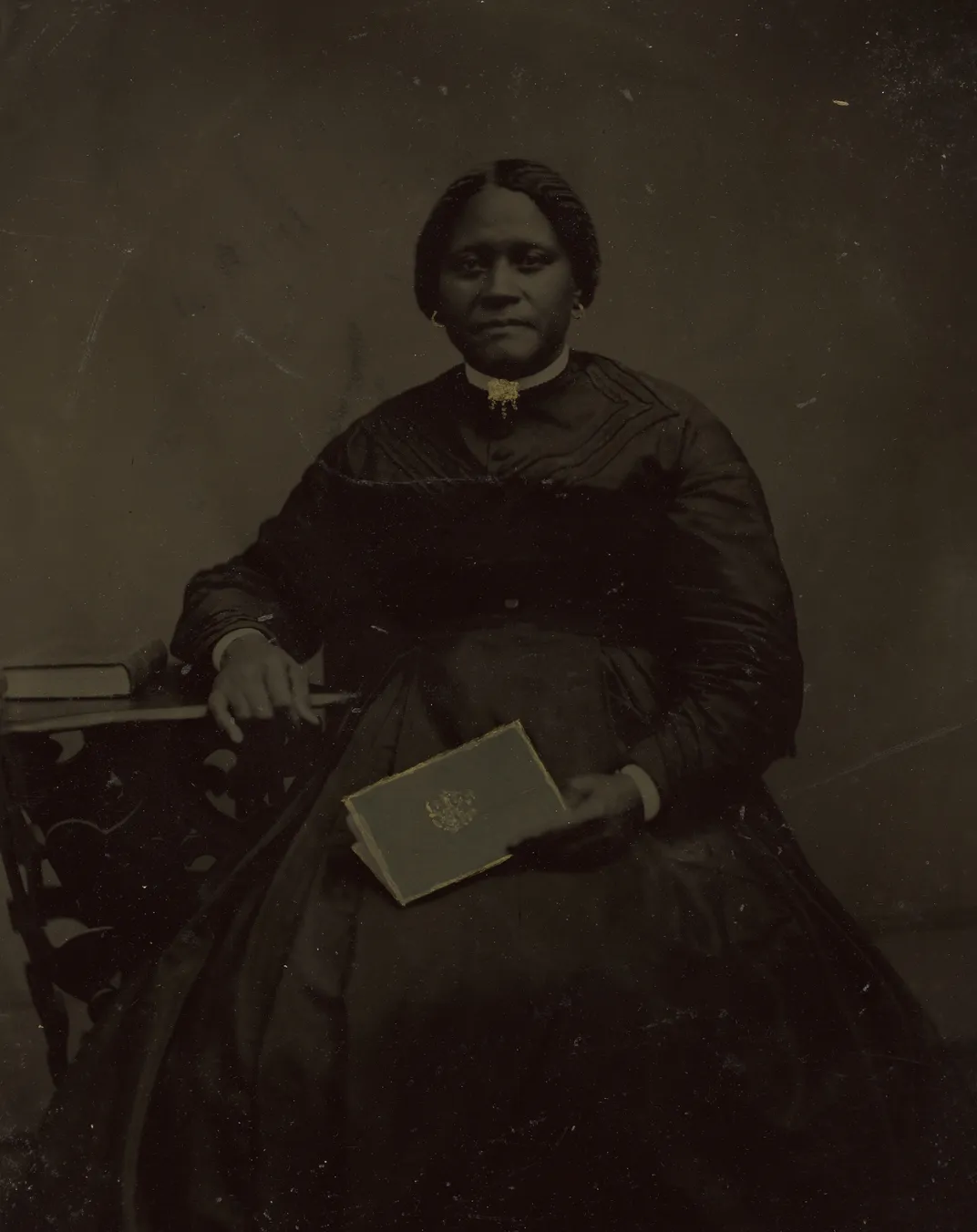 Unidentified woman, unidentified artist, whole-plate tintype, circa 1865