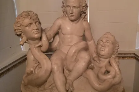 An Italian marble sculpture of William Pitt the Younger as the Infant Hercules Strangling the Serpents Fox and North by Pieratoni (called ’Sposino’), c.1790