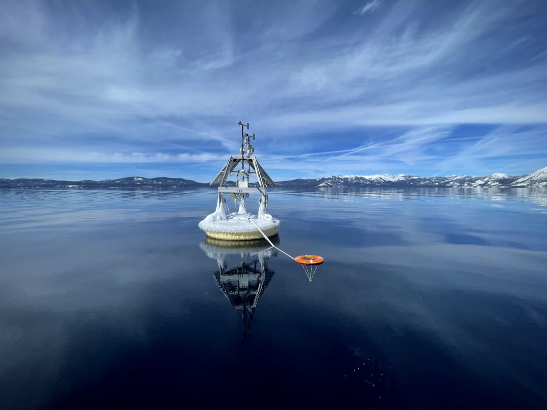 Science buoy floating on the surface of a lake
