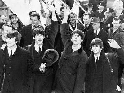 The Beatles arrive at John F. Kennedy International Airport in New York on February 7, 1964.