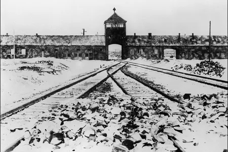 A picture taken in January 1945 depicts the gate and railway of Auschwitz-Birkenau after the camp's liberation by Soviet troops.