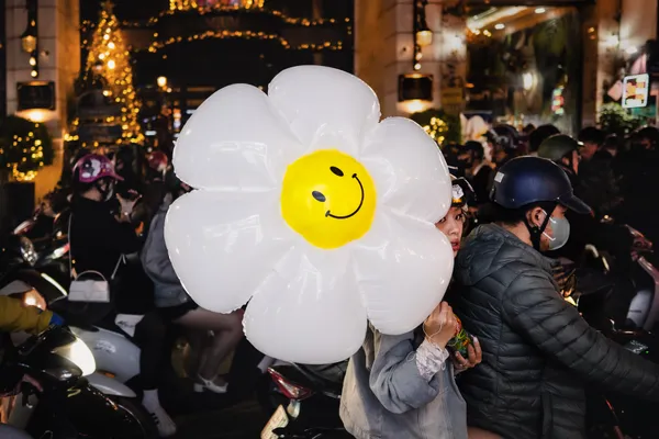 A Smiling Flower in Hanoi Traffic thumbnail