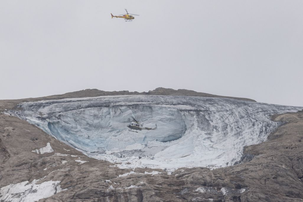 Helicopter above glacier