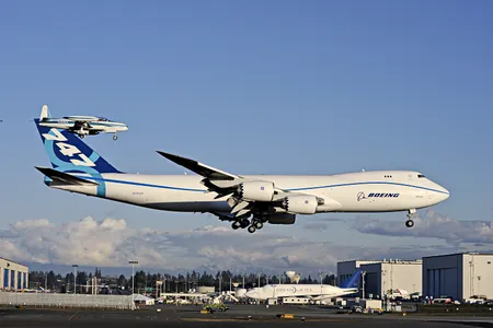 The Boeing behemoth on its first flight (with Lockheed T-33 chase plane), last February.