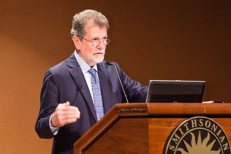 John Kress takes the stage at the Smithsonian symposium "Living in the Anthropocene".