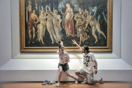 In July, protesters from Ultima Generazione glue their hands to the glass covering of Sandro Botticelli&#39;s Primavera.