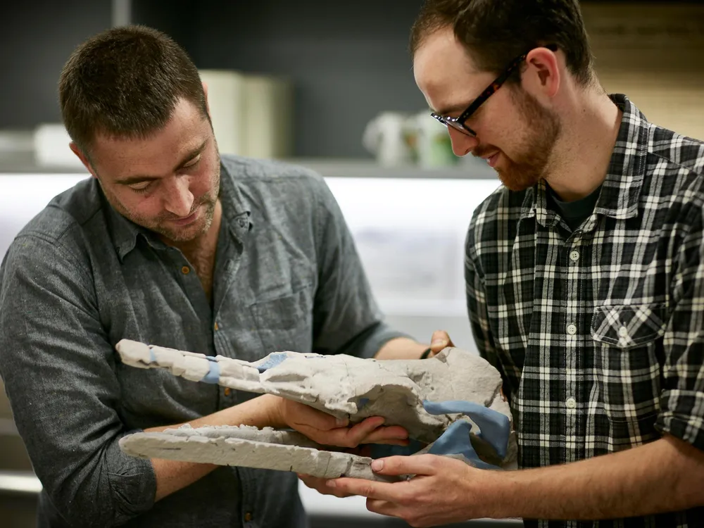 Dr. Erich Fitzgerald and Tim Ziegler with a 3D model of Alfred's skull_credit_Ben Healley.jpg