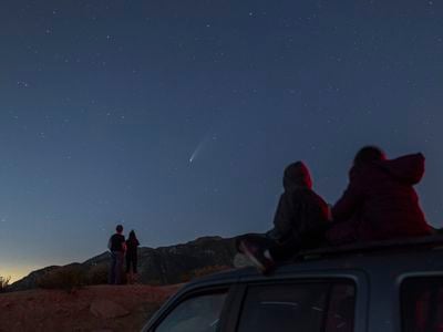 Stargazers watch Comet Neowise shoot across the sky on July 19, 2020 outside of Los Angeles, California.