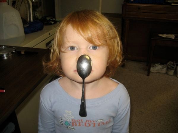 Young boy with spoon on nose. "What spoon?" thumbnail