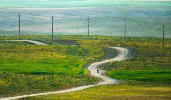 The beauty of a motorcycle trip on a rural dirt road thumbnail