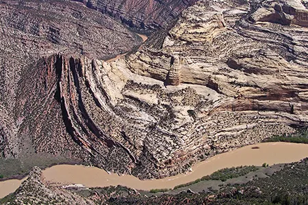 The Green River carves the landscape at Mitten Park fault, exposing rock layers formed more than a billion years ago – long before the dinosaurs.