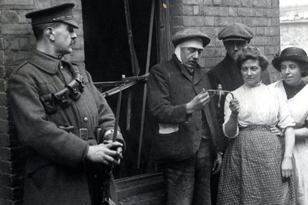 Examining a piece of a bomb dropped during a zeppelin raid, 1915.