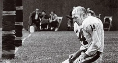 In his picture of Y. A. Tittle, Morris Berman captured the vanquished warrior's bloody struggle. But the now-classic photograph wasn't even published at first.
