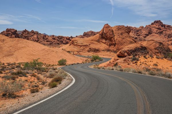An All-American stretch of road - winding through Nevada's colorful desert thumbnail