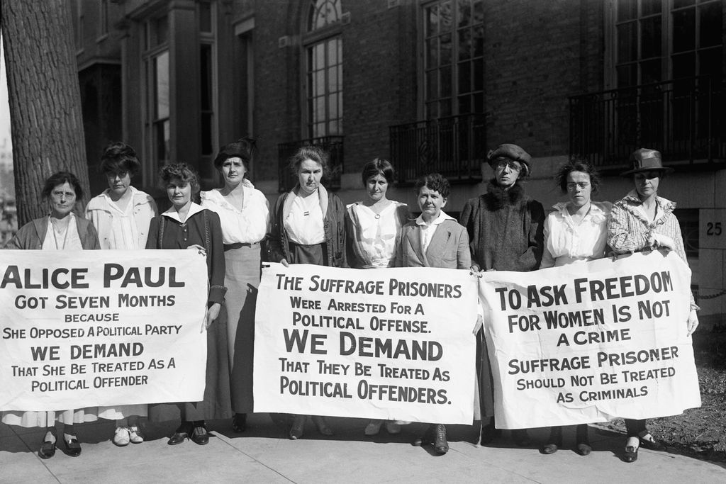 suffragists holding signs demanding political prisoner treatment for Alice Paul