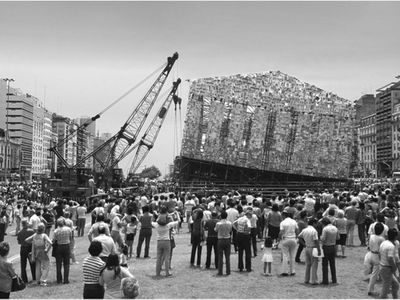 Argentinians look on as Marta Minují's 1983 Parthenon of books is removed with a crane. The artist will recreate her installation on a grander scale in Germany next year. 
