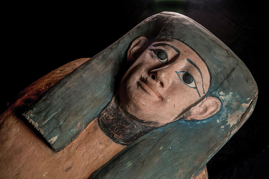 A painted wood coffin