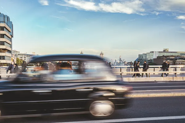 Capturing London's Pace: Black Cab Blurs Past Tower Bridge thumbnail