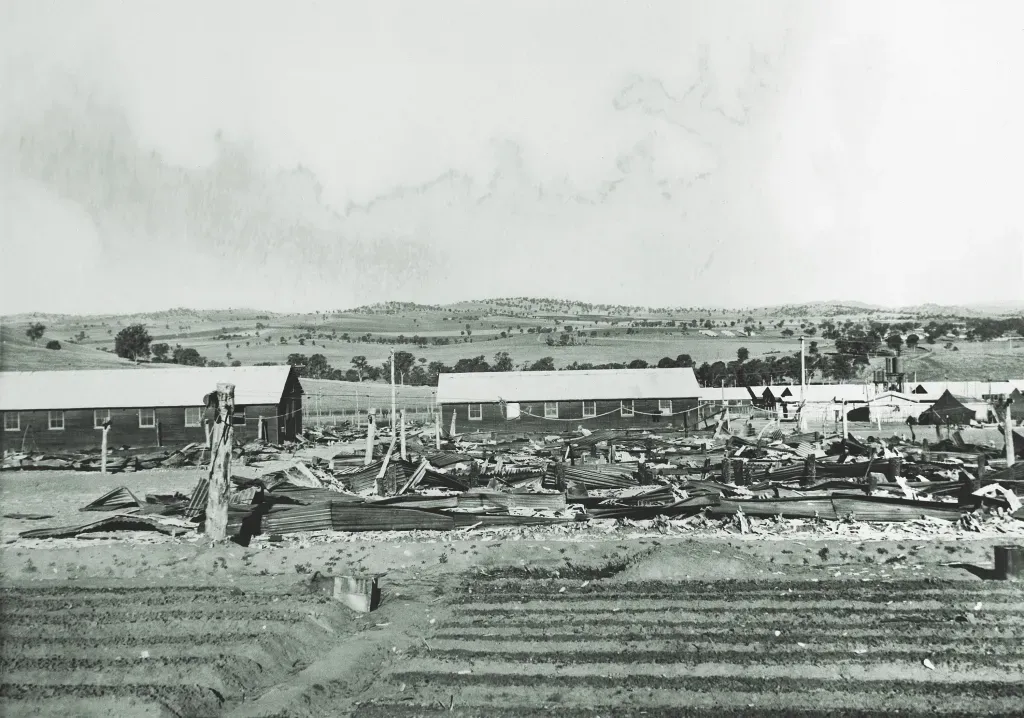 The ruins of burned huts at the Cowra POW camp