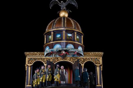 At the top of the Great Historical Clock, amid decorative flourishes,George Washington reviews his troops.