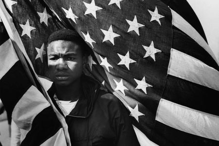 In the aftermath of the Civil War, more than four million newly freed Blacks sought fulfillment of the promises laid out in the U.S. Constitution. Says Kinshasha Holman Conwill, NMAAHC's deputy director: "The shadow of Reconstruction is a long shadow." (Above: Lewis "Big June" Marshall carries the flag during the Selma to Montgomery March in 1965.)