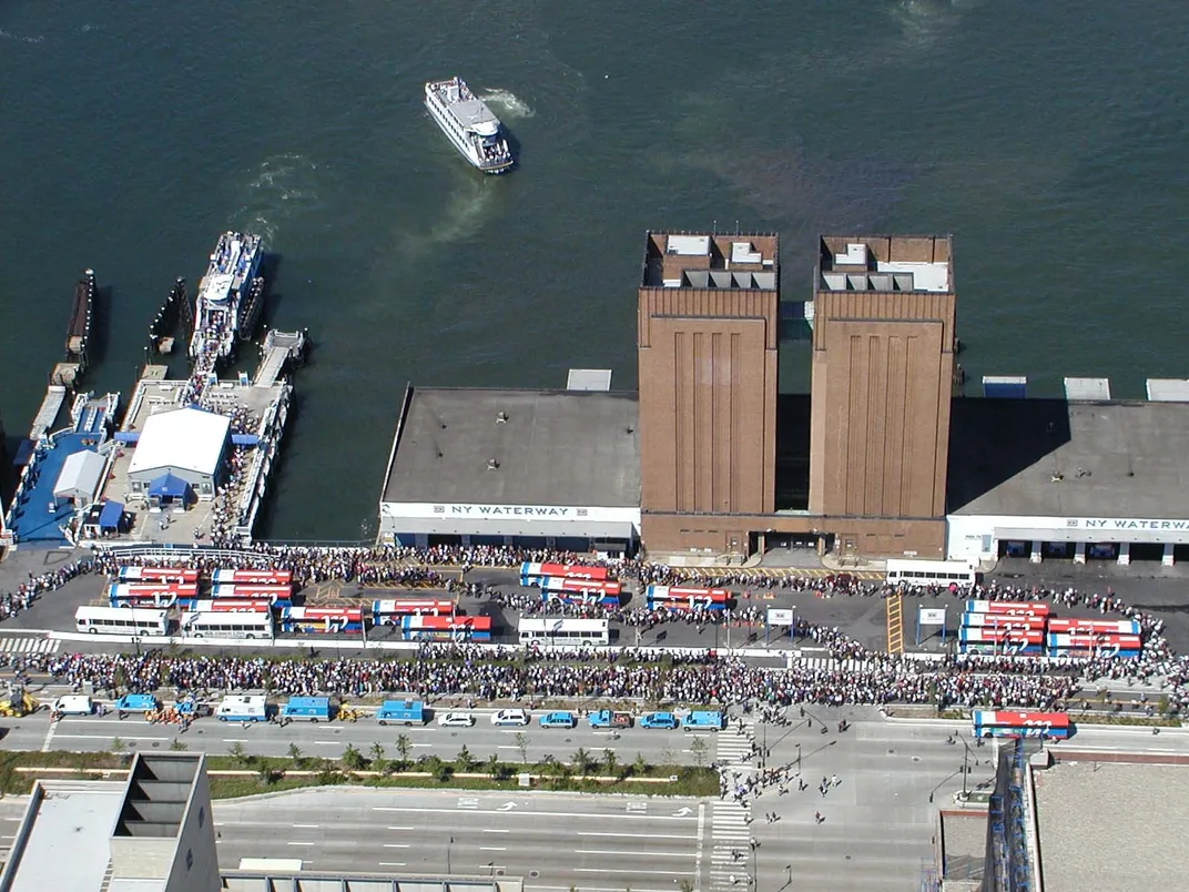 people lining up for boats