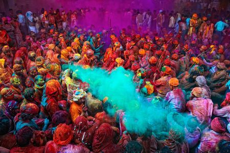 During Holi, people crowd the streets and splash brilliantly colored dyes on anyone walking by.
