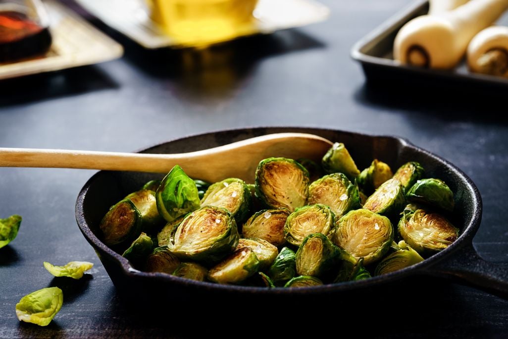 Cast iron skillet full of Brussels sprouts