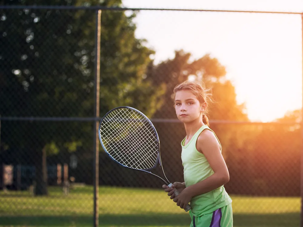 Child Playing Tennis