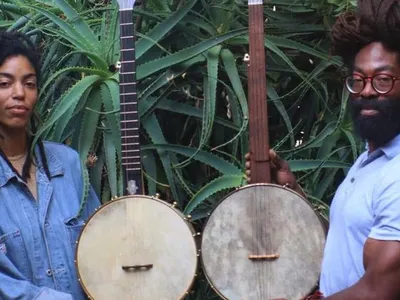 Black Banjo Reclamation Project founders Hannah Mayree and Carlton “Seemore Love” Dorsey, with banjos made by Brooks Masten of Brooks Banjos in Portland, Oregon.