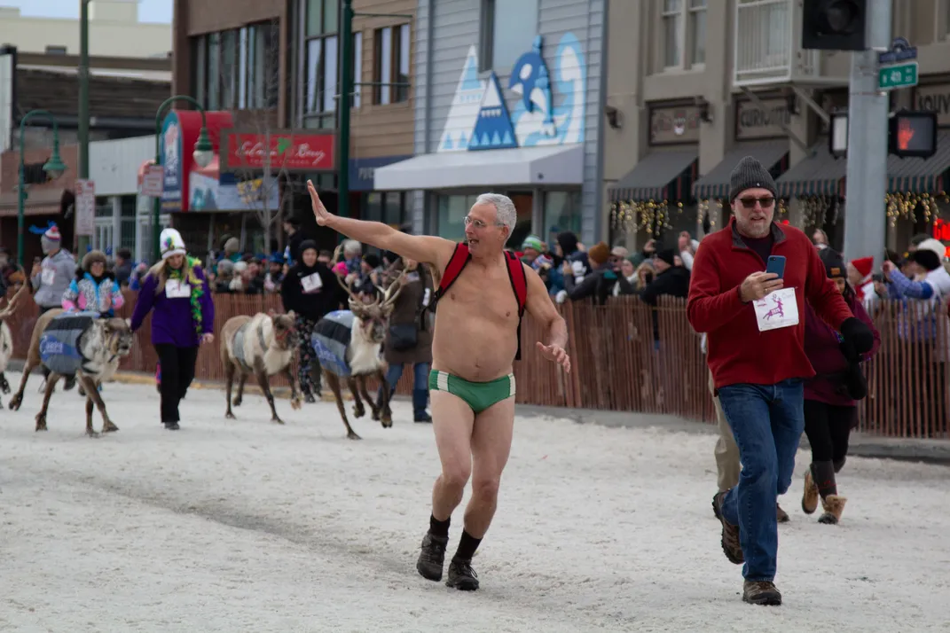 Man runs Running of the Reindeer in a speedo