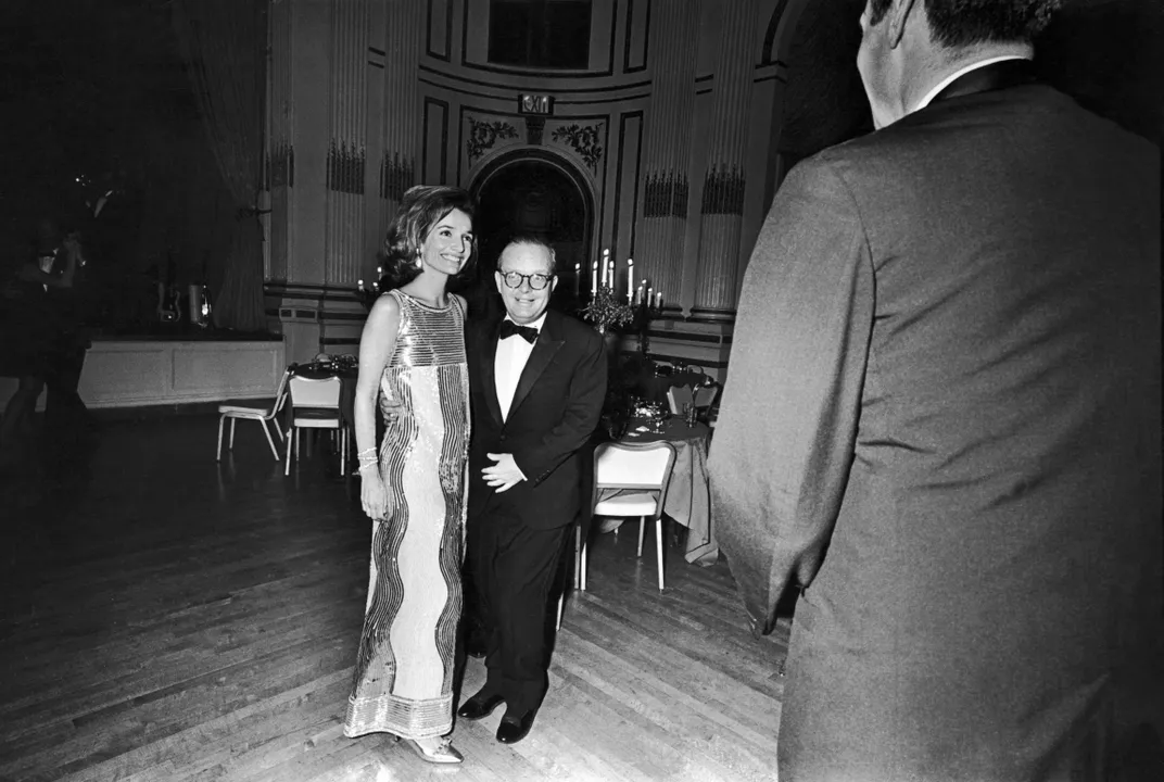 Lee Radziwill and Truman Capote pose together in the Grand Ballroom of the Plaza Hotel during Capote's 1966 Black-and-White Ball.