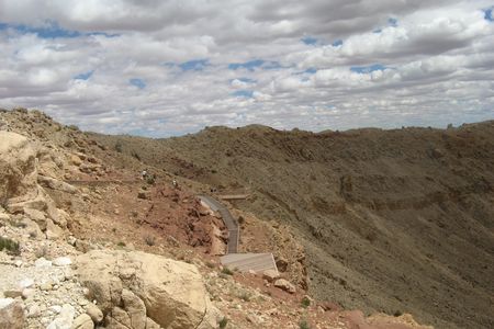 Meteor crater, the best preserved meteorite crater on Earth, approximates similar impact craters found on the Moon's surface.