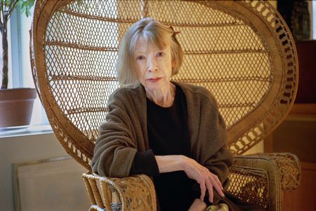 Joan Didion sitting in her wicker chair in 2003. The chair is one of the writer's many belongings being auctioned on November 16.