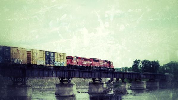 Freight Train crossing the Mississippi River. thumbnail