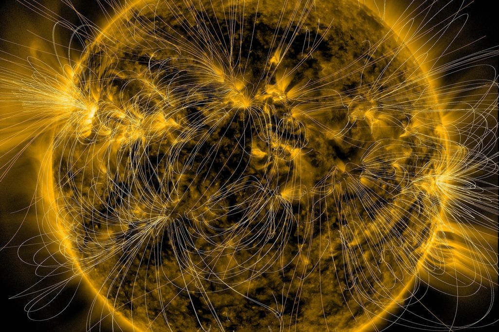 the yellow glowing sun with thin loops drawn coming off of it, concentrated around bright spots and more centered around the middle of the star, rather than its poles