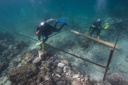 Some of the divers from Blue Water Recoveries excavating artifacts from the wreck of the Esmeralda