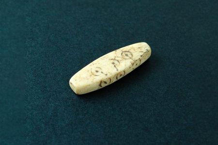 A one-inch-long gaming piece found at the site of a former Roman fort in Chester, England